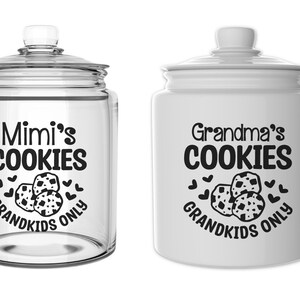 May include: Two cookie jars, one glass and one ceramic, with the text "Mimi's Cookies Grandkids Only" and "Grandma's Cookies Grandkids Only" on them. Both jars have a black and white image of cookies on them.