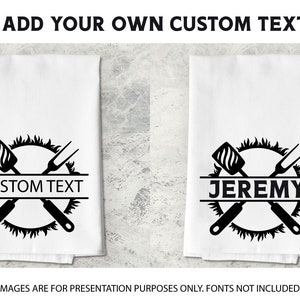 May include: Two white kitchen towels with black designs. The design is a circle with a crossed spatula and fork. The text "CUSTOM TEXT" and "JEREMY" are on the towels.