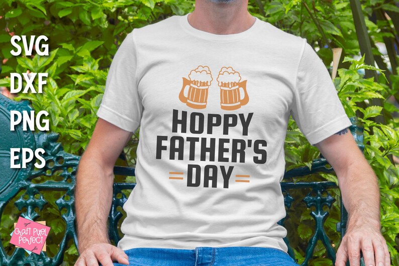 May include: White t-shirt with a graphic of two beer mugs and the text "Hoppy Father's Day".