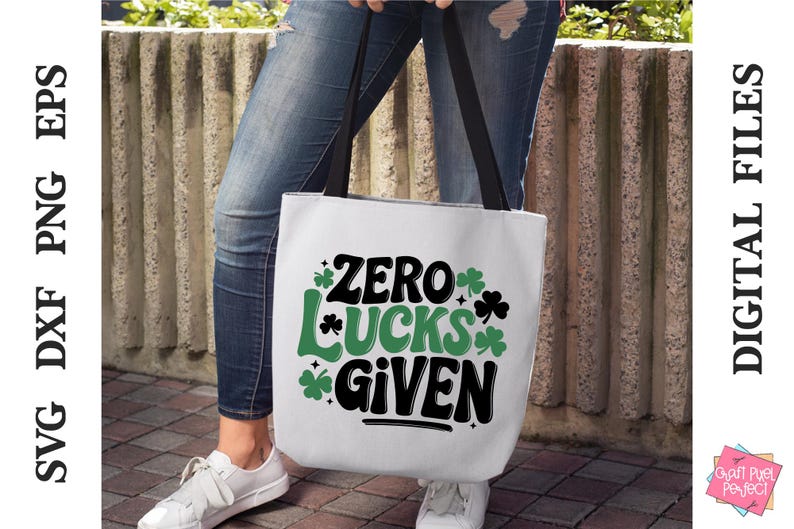 May include: A white tote bag with a green shamrock design and the text "Zero Lucks Given".