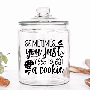 May include: A clear glass cookie jar with a black vinyl decal that reads "Sometimes you just need to eat a cookie".