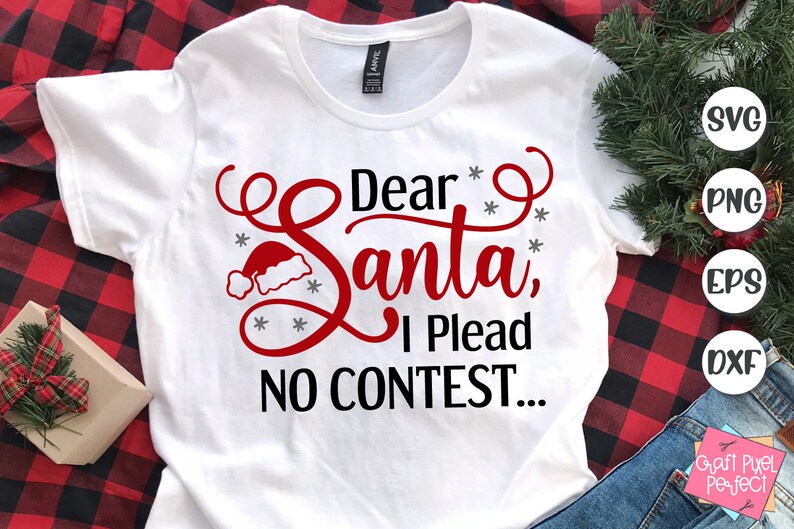 May include: White t-shirt with a red and black design that says "Dear Santa, I Plead No Contest..." with a Santa hat graphic.