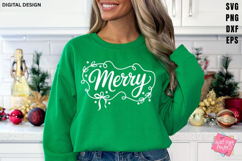 May include: A green sweatshirt with the word "Merry" in white script, framed by a decorative border of leaves and bows. The words "DIGITAL DESIGN" are at the top left. The sweatshirt is a festive holiday item.
