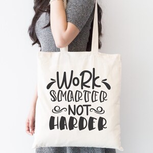 May include: A white tote bag with black text that reads "Work Smarter Not Harder".