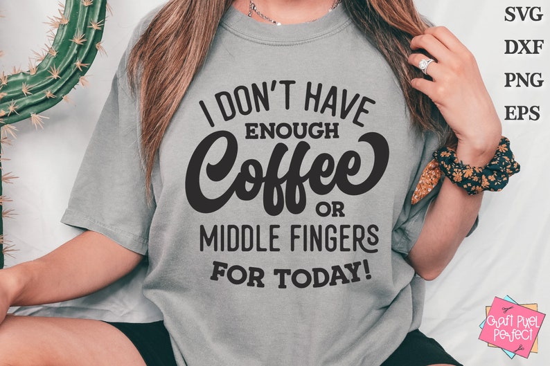 May include: A grey t-shirt with the text "I don't have enough coffee or middle fingers for today!" printed in black.