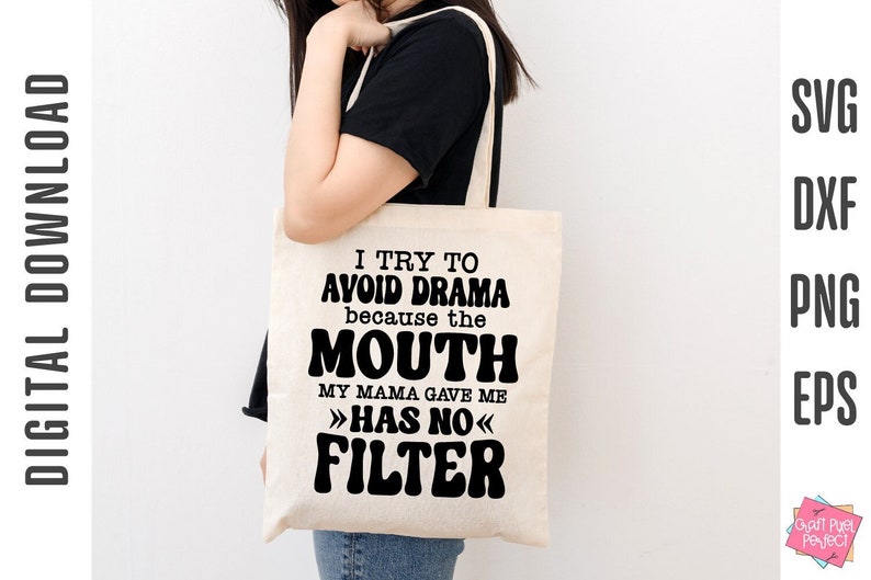 May include: A white tote bag with black text that reads "I try to avoid drama because the mouth my mama gave me has no filter".