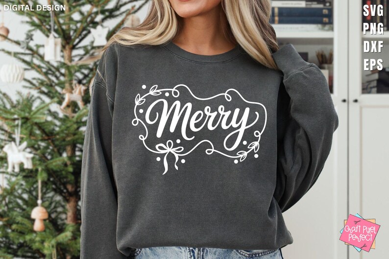 May include: A dark gray sweatshirt with the word "Merry" in white script, framed by a decorative border of leaves and bows. The design is centered on the chest. The sweatshirt is part of a digital design collection.
