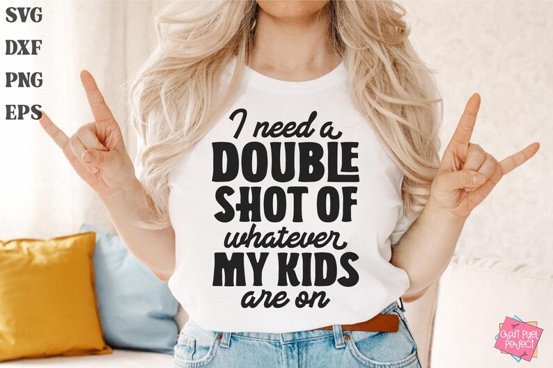 May include: A white t-shirt with black text that reads "I need a double shot of whatever my kids are on".