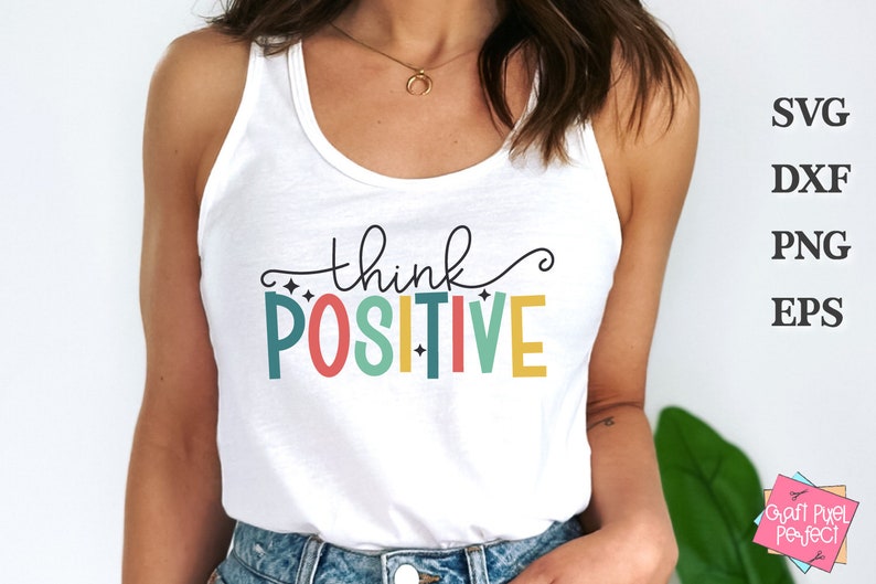 May include: A white tank top with the text "think positive" in colorful letters. The letters are outlined in black and have a white background. The text is centered on the shirt.