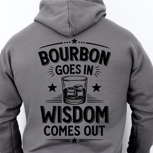 May include: A gray hoodie with a black graphic print that says "Bourbon goes in Wisdom comes out" with a stylized image of a glass of bourbon.