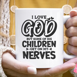 May include: White ceramic mug with a black graphic that reads "I love God but some of his children get on my nerves".