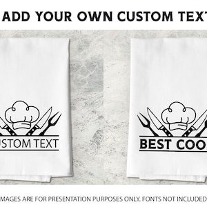 May include: Two white kitchen towels with black outlines of crossed chef's knives and a chef's hat. One towel says "CUSTOM TEXT" and the other says "BEST COOK".