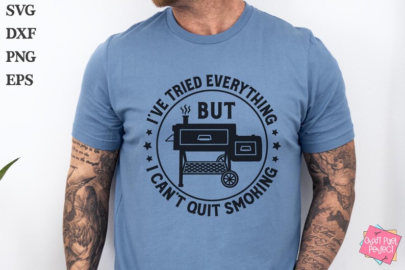 May include: A blue t-shirt with a black graphic of a smoker and the text "I've tried everything but I can't quit smoking."