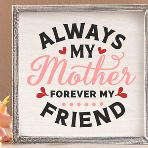 May include: A white sign with a gray frame reads "Always My Mother Forever My Friend" in black and pink lettering with red hearts.