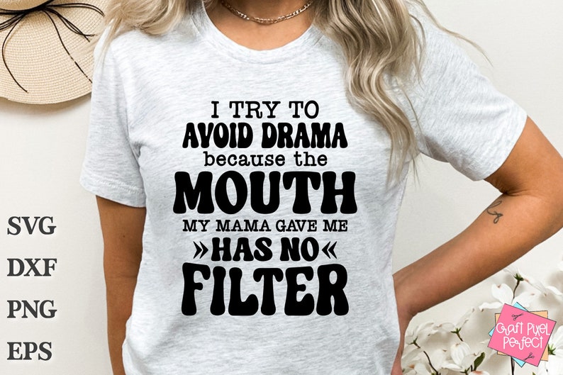 May include: A white t-shirt with black text that reads "I try to avoid drama because the mouth my mama gave me >>has no<< filter".