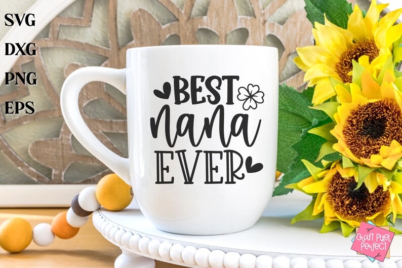 May include: White ceramic mug with a black design that says "BEST nana EVER" with a heart and a four-leaf clover.