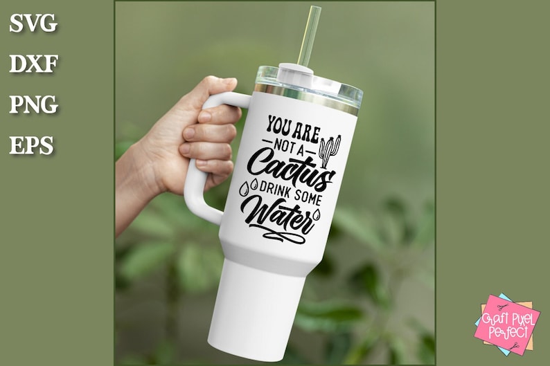 May include: White travel mug with a black handle and a black graphic that says "You are not a cactus drink some water" with a cactus illustration.