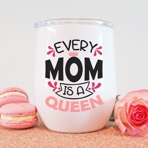 May include: White tumbler with a pink and black design that says "Every Mom is a Queen".
