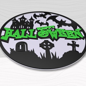 May include: Black and green Halloween sign with a haunted house, bats, a graveyard, and the text "Happy Halloween".