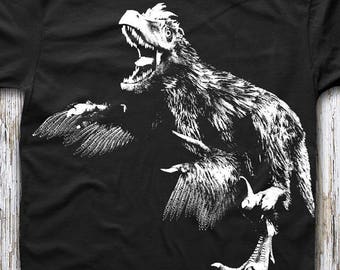 Buy 2, Get 1 FREE Tshirt! Feathered Raptor Shirt. Feathered Velociraptor Unisex Tee for Men or Women. Black Ringspun Cotton.