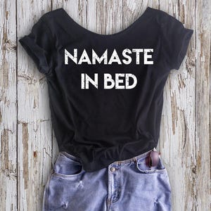 Buy 2, Get 1 FREE Tshirt NAMASTE In BED! Women&#39;s Off  Shoulder Slouchy Tee
