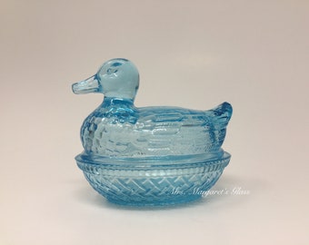 Wilkerson Glass Stardust Blue UV Pink Glow Duck On Nest