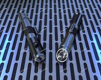 May include: Two silver lightsabers with black handles, one with a green blade and one with a blue blade, are lying on a silver metal surface with a grid pattern.