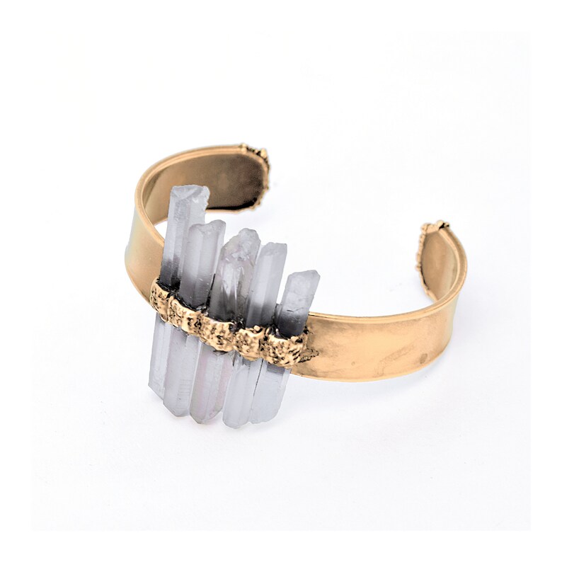 May include: A gold metal cuff bracelet with a cluster of clear quartz crystals set in the centre.