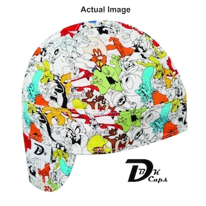 May include: A white welding cap featuring a colorful cartoon print with characters like Bugs Bunny, Daffy Duck, and Taz. The cap has a curved brim and the text "Dk Caps" is printed on the side.