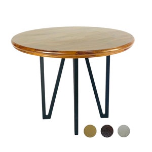 May include: A round wooden side table with a light brown tabletop and a dark brown trim. The table has three black metal legs. The table is approximately 24 inches in diameter and 20 inches tall.