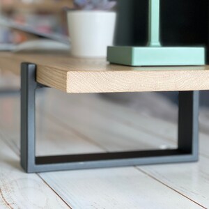 Wooden desktop monitor raised stand and home office desk riser, perfect as a computer stand and essential work-from-home desk accessory for organizing and elevating your workspace.