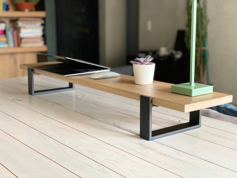 Wooden desktop monitor raised stand and home office desk riser, perfect as a computer stand and essential work-from-home desk accessory for organizing and elevating your workspace.