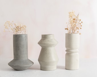 Abstract concrete vases, three minimal vase styles and multiple colours. Perfect for dried flowers