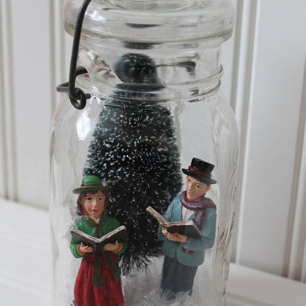 Vintage clear Ball Ideal mason jar with glass lid and wire bail filled with snow, christmas tree and carolers