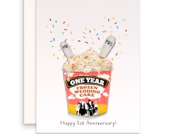 May include: A red and white ice cream container with the text "One Year Frozen Wedding Cake" and two spoons with the words "Mr." and "Mrs." on them. The container is filled with ice cream and sprinkles. The text "Happy 1st Anniversary!" is below the container.