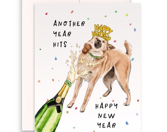 May include: A humorous New Year's card featuring a cartoon dog wearing a "Happy New Year" party hat and being sprayed with champagne. The text reads "Another year hits" and "Happy New Year".