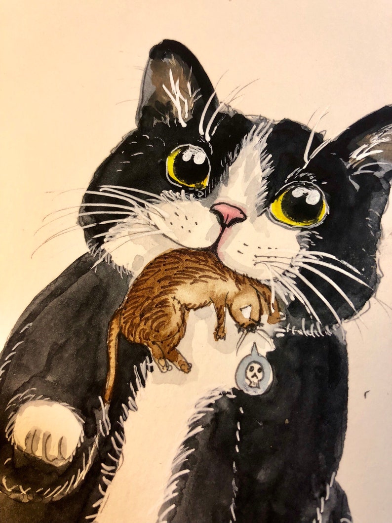 May include: A black and white cat with yellow eyes is holding a smaller brown and white cat in its mouth. The larger cat has a skull and crossbones charm on its collar.