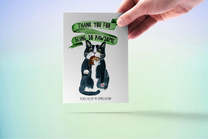 May include: A greeting card featuring a black and white cat holding a brown mouse. The card has a green ribbon with the text "Thank you for being so pawsome" and the text "Please accept my appreciation!" at the bottom.