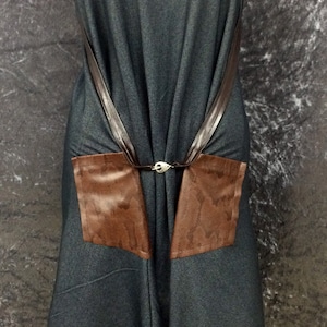 Unique, one-ff, dark denim jersey, multi-way dress with faux snakeskin pockets and faux leather trim. Size: UK 10
