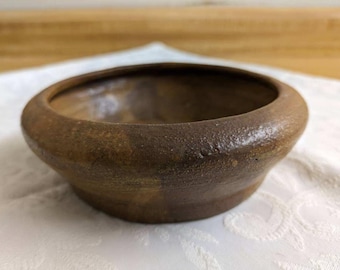 Vtg. pottery bowl, shallow, handmade, signed. Brown glaze.