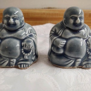 Vtg. reclining Buddah ceramic figurines; blue glazed; pair.