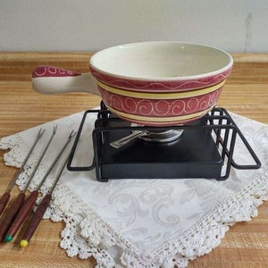 Vtg. fondue set; wrought iron stand, burner, stoneware pot, four forks.