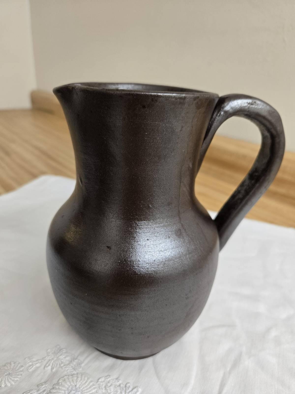 Vtg. pottery pitcher, brown glazed, signed, made in France.