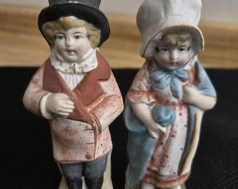 Vtg. German bisque painted boy/girl couple set.