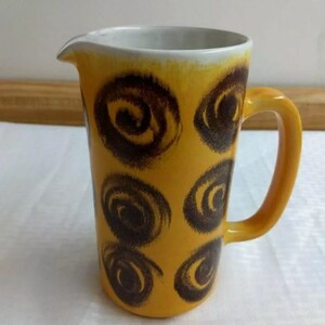 MCM art pottery pitcher; signed.