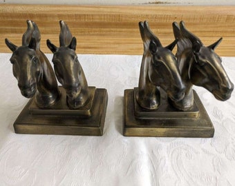 Vtg. double horse head metal bookends pair.