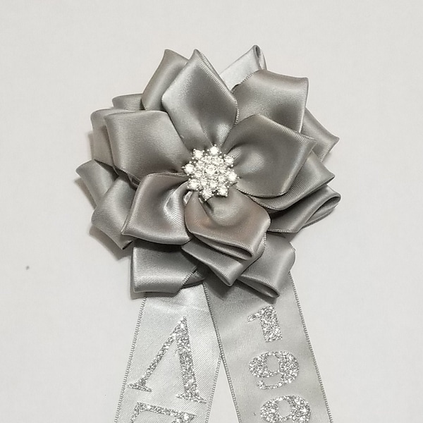 Silver anniversary corsage with detachable tail