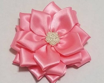 Pink brooched flower