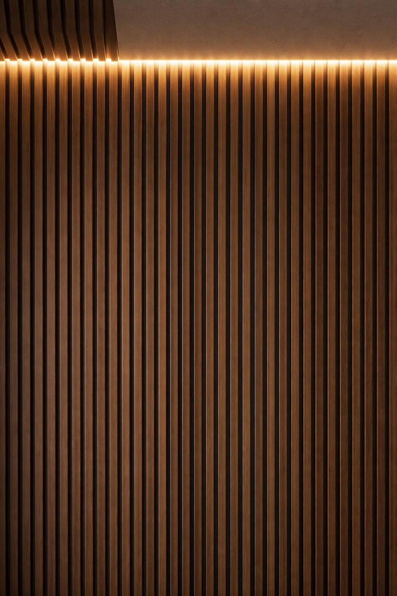 May include: A vertical wood slat wall with a warm brown color. The slats are evenly spaced and run from the bottom to the top of the image. A warm, yellow light strip is at the top of the wall.