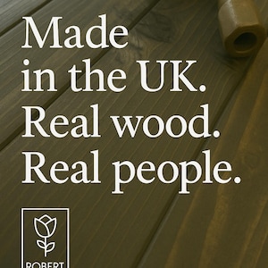 May include: A close-up of a wooden surface with the text "Made in the UK. Real wood. Real people." and a stylized white tulip logo with the text "Robert Rose" below it.